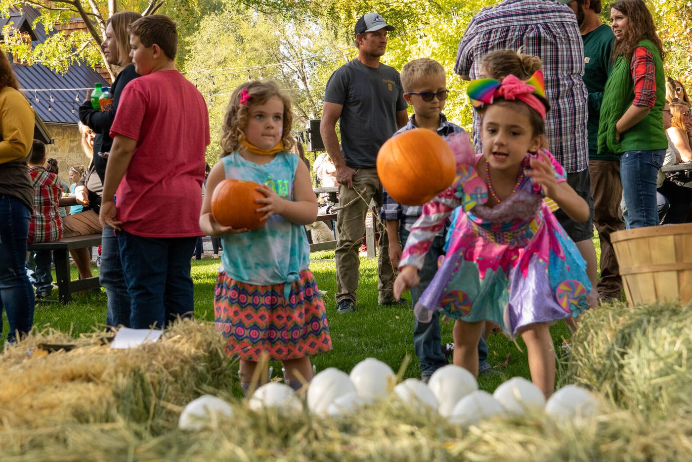 Kids at the Fall Festival pumpkin throw